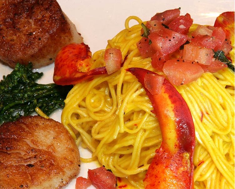 Seared Dry Scallops and Lobster Atop Saffron Sauced Pasta